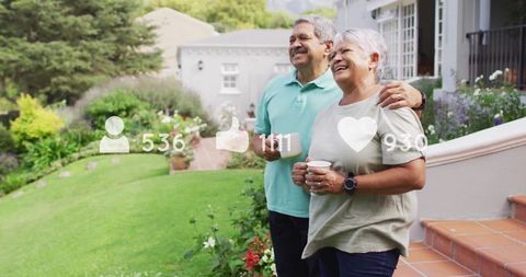 Happy Senior Couple Relaxing Outdoors with Mugs on Porch