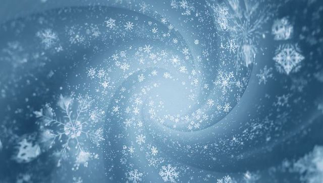 Icy snowflake spiral creating luminous blue vortex with soft bokeh and crystal sparkle
