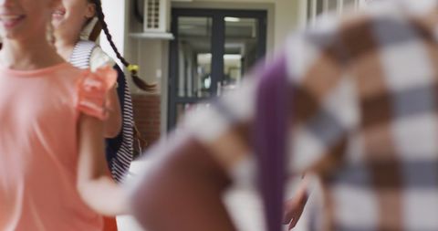 Happy Children Running in School Corridor Celebrating Diversity