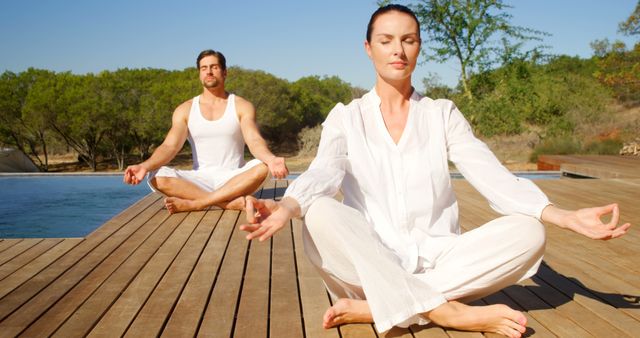 Couple Practicing Yoga Outdoors by Pool Next to Beautiful Nature Setting - Download Free Stock Images Pikwizard.com