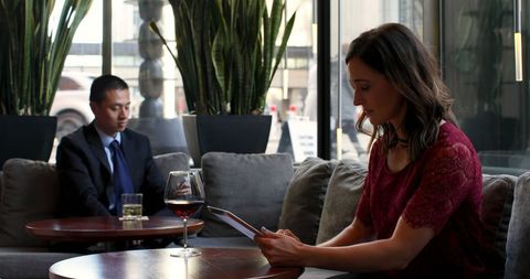 Businesspeople Working in Modern Hotel Lounge Setting