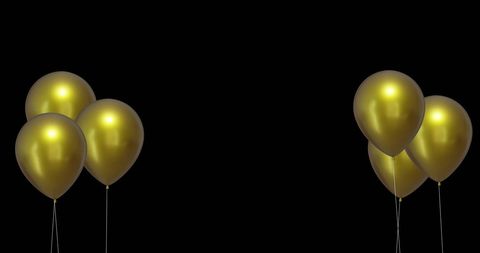 Gold Balloons in Dramatic Black Background