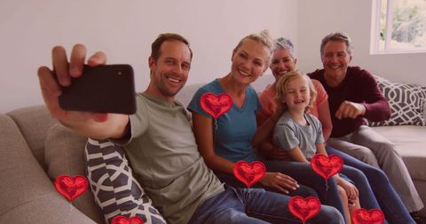 Happy Family Capturing Moments with Smartphone Selfie