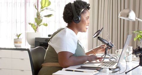 Woman Podcasting from Home Office with Microphone Setup