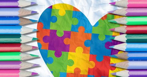 Autism awareness heart with colorful pencils around