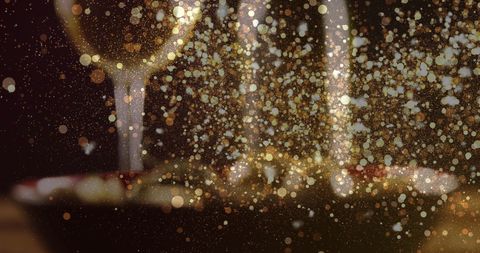 Golden Bokeh Sparkles with Glass of White Wine and Olives
