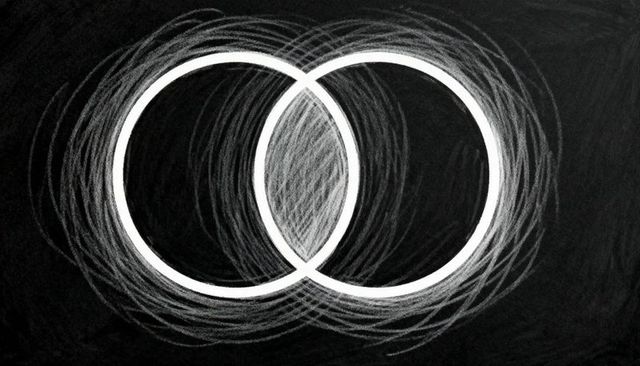 Overlapping chalk rings featuring crosshatched shaded intersection on dark blackboard