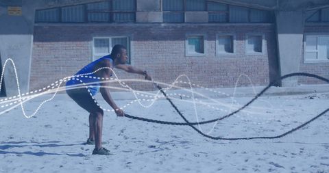 Athletic Man Exercising with Ropes Digital Overlay