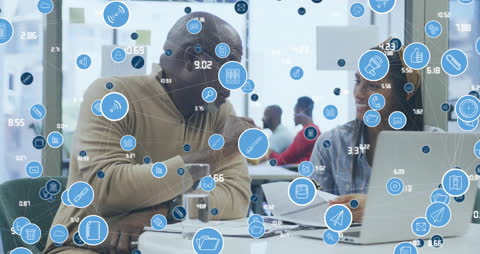 Digital Networking Icons Overlaying Business Meeting