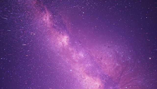 Vibrant milky way galaxy under mystical purple sky