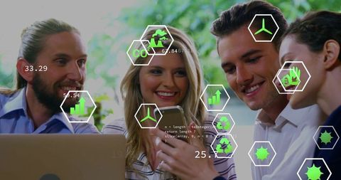 Team collaborating with ar data overlays on smartphone and laptop visualizing sustainability
