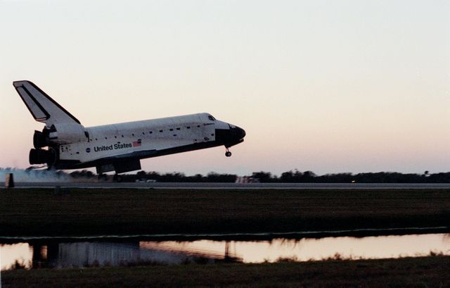 KENNEDY SPACE CENTER, Fla. -- The nearby water reflects Space Shuttle Endeavour as it touches down on KSC's Shuttle Landing Facility Runway 33 to complete the 11-day, 5-hour, 38-minute-long STS-99 mission. Main gear touchdown was at 6:22:23 p.m. EST Feb. 22 , landing on orbit 181 of the mission. Nose gear touchdown was at 6:22:35 p.m.. EST, and wheel stop at 6:23:25 p.m. EST. At the controls are Commander Kevin Kregel and Pilot Dominic Gorie. Also onboard the orbiter are Mission Specialists Janet Kavandi, Janice Voss, Mamoru Mohri of Japan and Gerhard Thiele of Germany. Mohri is with the National Space Development Agency (NASDA) and Thiele is with the European Space Agency. The crew are returning from the Shuttle Radar Topography Mission, after mapping more than 47 million square miles of the Earth. This was the 97th flight in the Space Shuttle program and the 14th for Endeavour, also marking the 50th landing at KSC, the 21st consecutive landing at KSC, and the 28th in the last 29 Shuttle flights