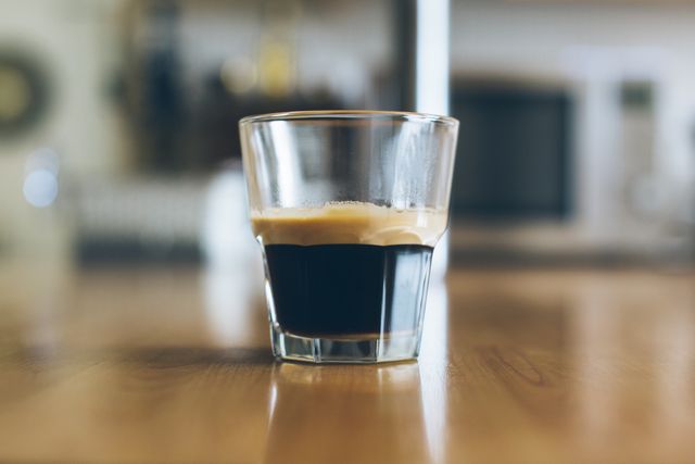 Perfect for coffee shops, kitchens, or home decor. Ideal for websites, blogs, or advertisements related to coffee, beverages, or morning routines. The focused espresso shot highlights how it's freshly brewed, enhancing appeal for cafes or coffee lovers.