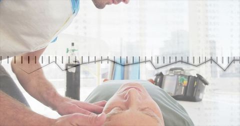 Therapist conducting physiotherapy with patient in clinic setting