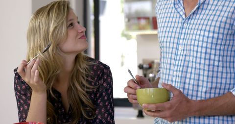 Cheerful Couple Enjoying Casual Meal at Home