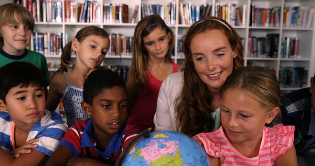 Teacher and Diverse Children Learning with Globe in Classroom - Download Free Stock Images Pikwizard.com