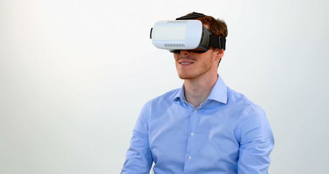 Man Using Virtual Reality Headset Wearing Blue Shirt - Download Free Stock Images Pikwizard.com