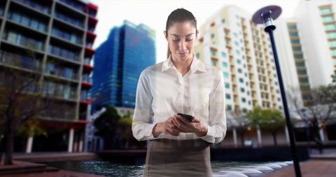 Businesswoman Explores Technology in Urban Environment