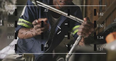 Automotive Mechanic Repairing Engine with Digital Data Overlay Guiding Diagnostics