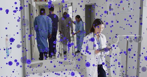 Busy hospital corridor with diverse staff and digital overlay