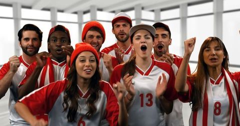 Diverse Group of Enthusiastic Sports Fans Cheering