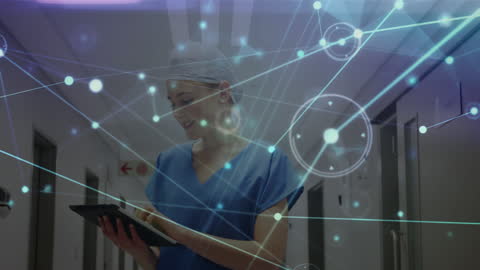 Caucasian Female Surgeon Using Digital Tablet in Connected Network
