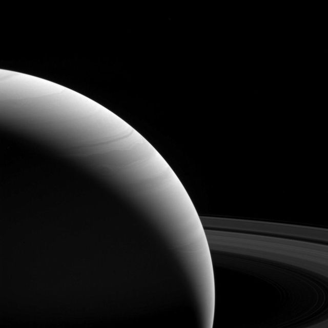 The light of a new day on Saturn illuminates the planet's wavy cloud patterns and the smooth arcs of the vast rings.  The light has traveled around 80 minutes since it left the sun's surface by the time it reaches Saturn. The illumination it provides is feeble; Earth gets 100 times the intensity since it's roughly ten times closer to the sun. Yet compared to the deep blackness of space, everything at Saturn still shines bright in the sunlight, be it direct or reflected.  This view looks toward the sunlit side of the rings from about 10 degrees above the ring plane. The image was taken with the Cassini spacecraft wide-angle camera on Feb. 25, 2017 using a spectral filter which preferentially admits wavelengths of near-infrared light centered at 939 nanometers.  The view was obtained at a distance of approximately 762,000 miles (1.23 million kilometers) from Saturn. Image scale is 45 miles (73 kilometers) per pixel.  https://photojournal.jpl.nasa.gov/catalog/PIA21336