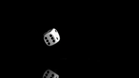 White Die Bouncing on Black Background in Slow Motion