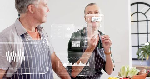 Senior couple cooking in bright kitchen tasting fresh vegetables with smart hud overlay