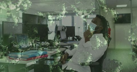 Businessman in Office Wearing Mask Amid Floating COVID-19 Cells