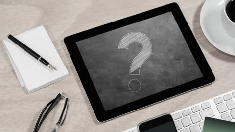 Digital Tablet Displaying Question Mark on Chalkboard Screen