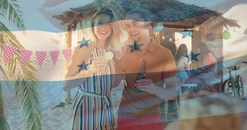 Couple Enjoying Drinks at Beachside Tiki Bar Celebration