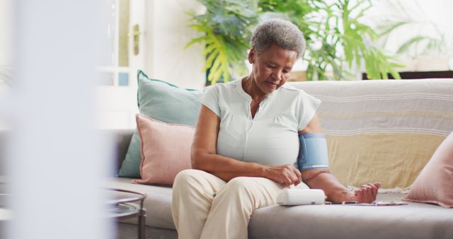 Senior Woman Monitoring Blood Pressure at Home - Download Free Stock Images Pikwizard.com