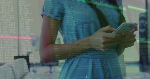 Businesswoman with Smartphone over Code in Modern Office Environment