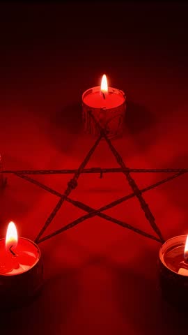 Vertical ritual video showing red candle flames flickering around twig pentagram creating eerie glow