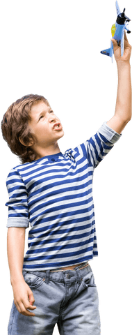 Child Wearing Striped Shirt Holding Toy Airplane - Download Free Stock Videos Pikwizard.com