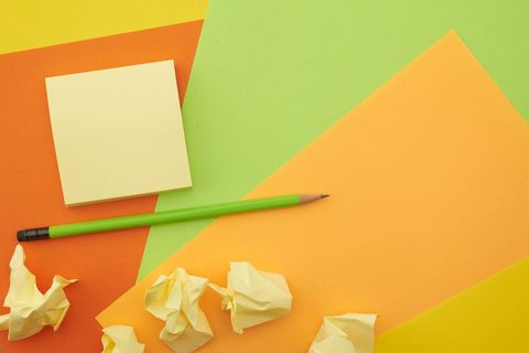 Colorful Office Supplies with Crumpled Paper and Sticky Notes
