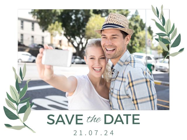 Caucasian couple smiling and taking a selfie in an outdoor setting, surrounded by nature-inspired decorative plants. Ideal for use in wedding announcements, save the date notifications, digital or printed invitation cards, and social media wedding reminders.
