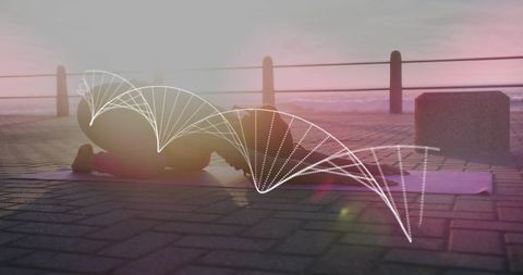 African American Woman Practicing Yoga with DNA Overlay at Sunrise