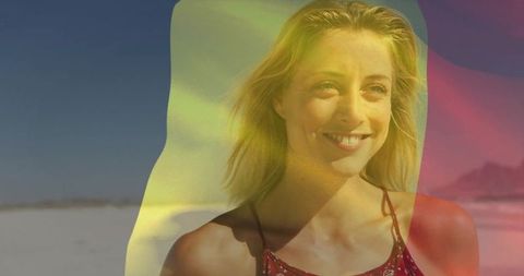 Smiling blonde woman enjoying sunlit beach with colorful overlay and dreamy summer vibe