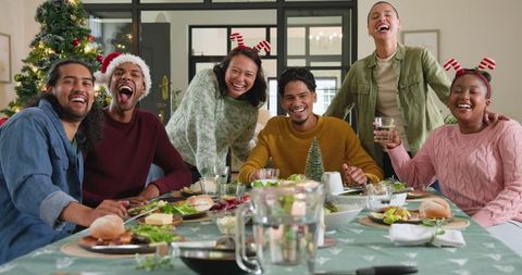 Diverse Friends Enjoying Festive Holiday Meal at Home