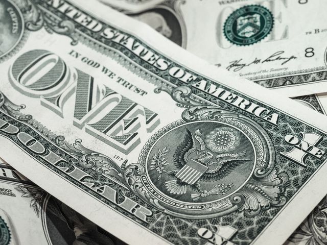 Close-up image showcases intricate details of a US one dollar bill. Perfect for illustrating themes of finance, economy, currency, or wealth. Useful in blog posts, educational presentations, finance reports, and economic studies to convey monetary concepts.