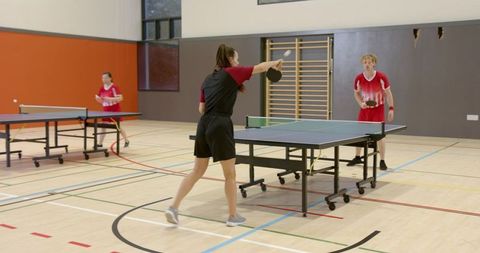 Energetic Table Tennis Match in Modern Sports Hall