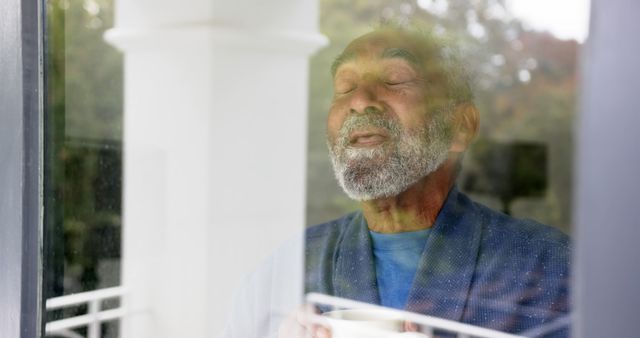 Tranquil Elderly Man Enjoying Peaceful Moment by Window with Coffee - Download Free Stock Images Pikwizard.com