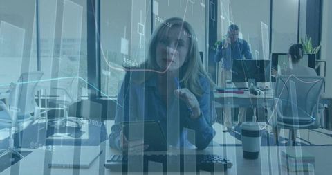 Businesswoman Analyzing Data in Modern Office with Digital Graphics Overlay