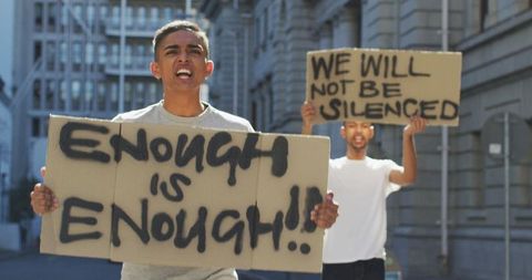 Protesters Holding Placards Marching for Social Justice