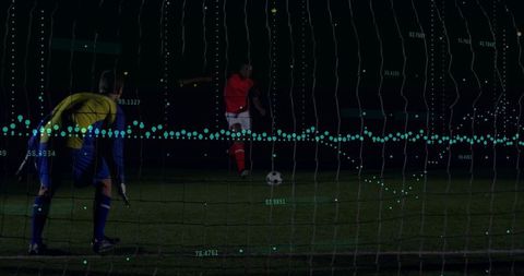 Penalty kick under lights with goalkeeper and teal analytics overlay showing trajectory