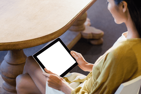 high angle view of woman using transparent tablet by wooden table - Download Free Stock Videos Pikwizard.com