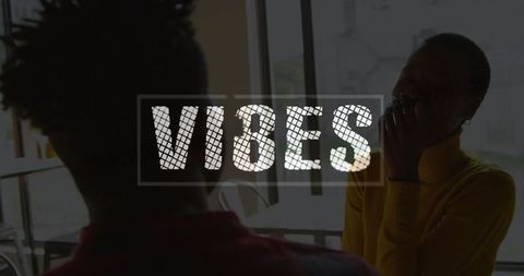 Close Friends Laughing and Enjoying Social Time in Urban Café Setting