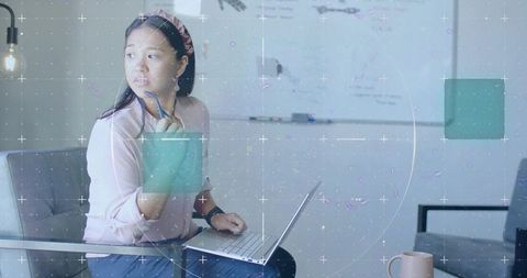 Woman Deep in Thought with Laptop at Office